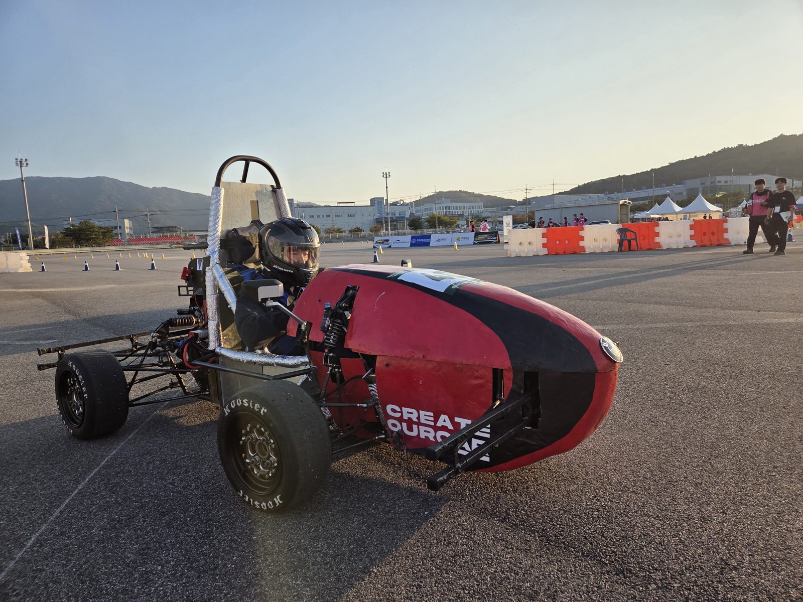 Student-built EV race car on track on day three of the competition, after a relay failure ended our semifinal